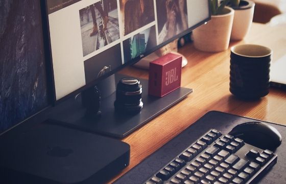 Computer desk with desktop and keyboard 